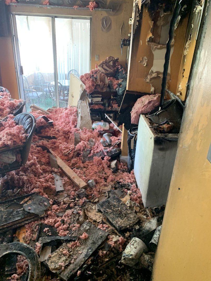 Kirkwood Construction's Kitchen Fire Restoration - Before: Smoke-damaged cabinets and walls